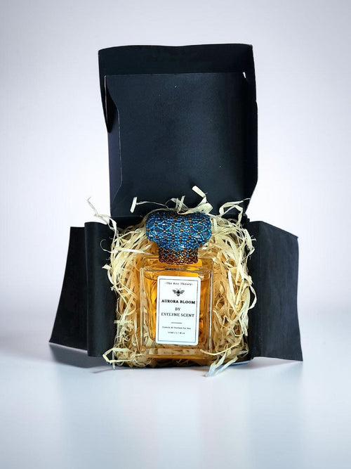 Evelyne Scent Aurora Bloom 30ml Ethanol-free, alcohol-free, extrait de parfum non-greasy sprayable oil perfume with beaded cap and black box packaging with shredded wood, and black tissue 